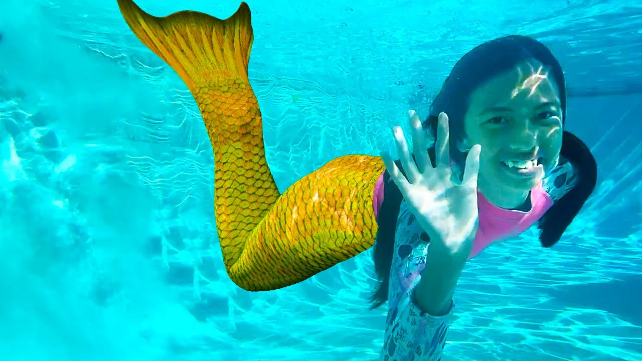 sirenas nadando en aguas magicas